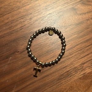 Rustic cuff bracelet with “t” charm